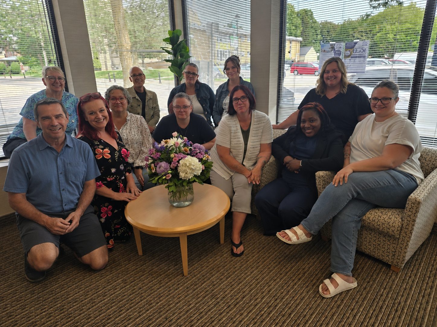 The Access Community Services management team gathered together in the agency office